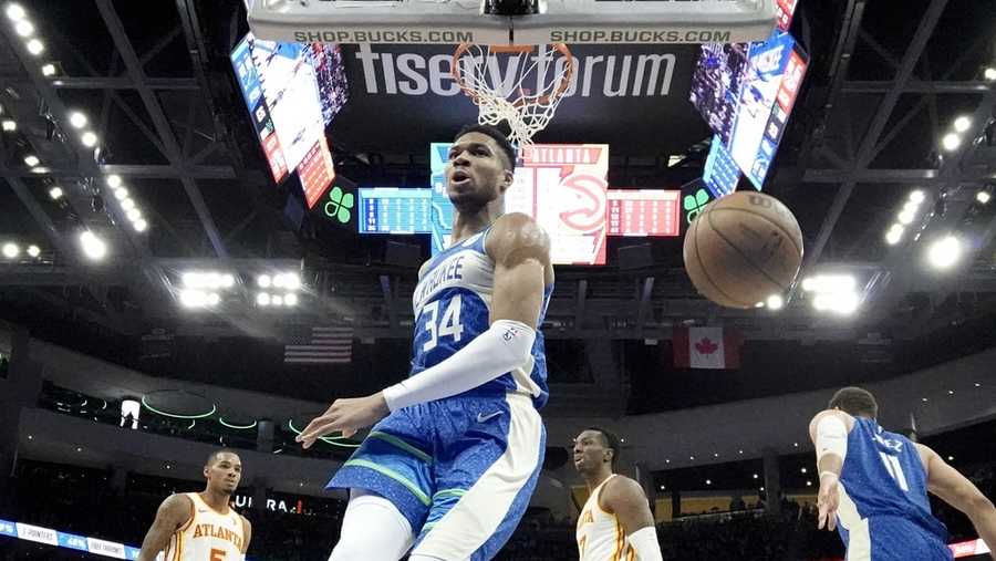 Milwaukee Bucks&apos; Giannis Antetokounmpo reacts after his dunk during the second half of an NBA basketball game against the Atlanta Hawks Saturday, Dec. 2, 2023, in Milwaukee. The Bucks won 132-121. (AP Photo/Morry Gash)