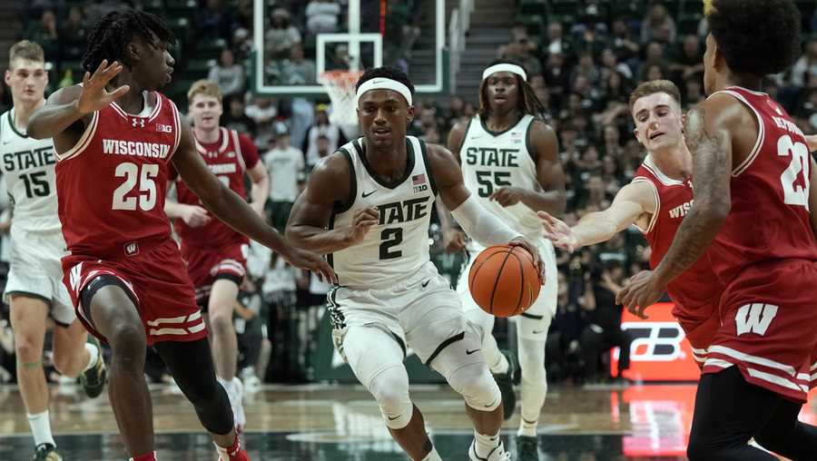 Michigan State guard Tyson Walker (2) brings the ball up court during the second half of an NCAA college basketball game against Wisconsin, Tuesday, Dec. 5, 2023, in East Lansing, Mich. (AP Photo/Carlos Osorio)