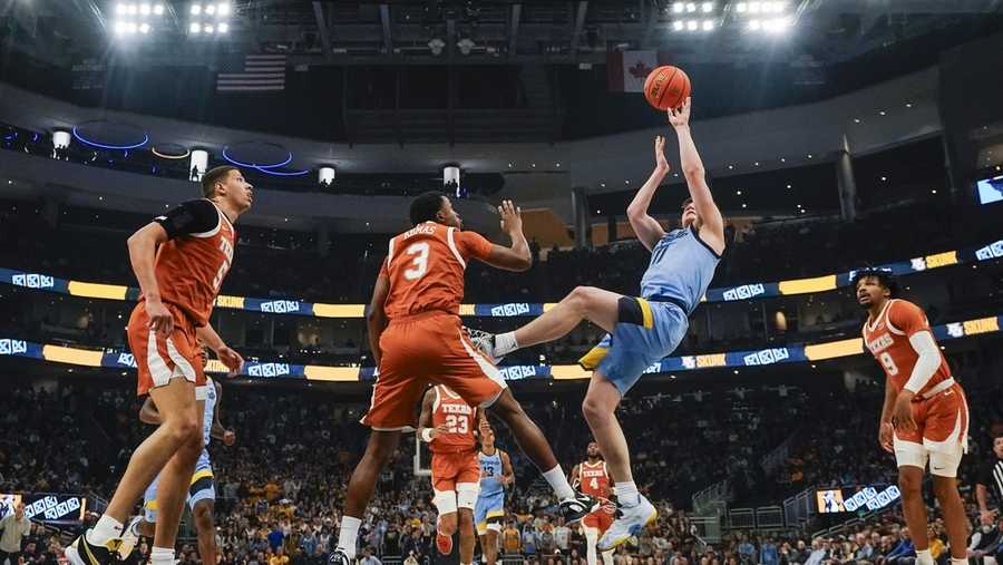 Marquette'ss Tyler Kolek shoots during the first half of an NCAA college basketball game against Texas Wednesday, Dec. 6, 2023, in Milwaukee. Marquette won 86-65. (AP Photo/Morry Gash)